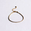Steel "twisted" bracelet small – gold