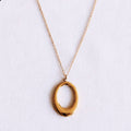 Delicate necklace with oval charm - gold