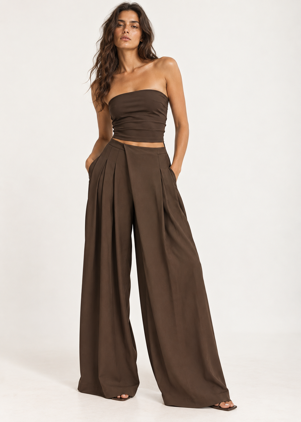 Back view of brown wide-leg trousers showing the gathered elasticated waistband