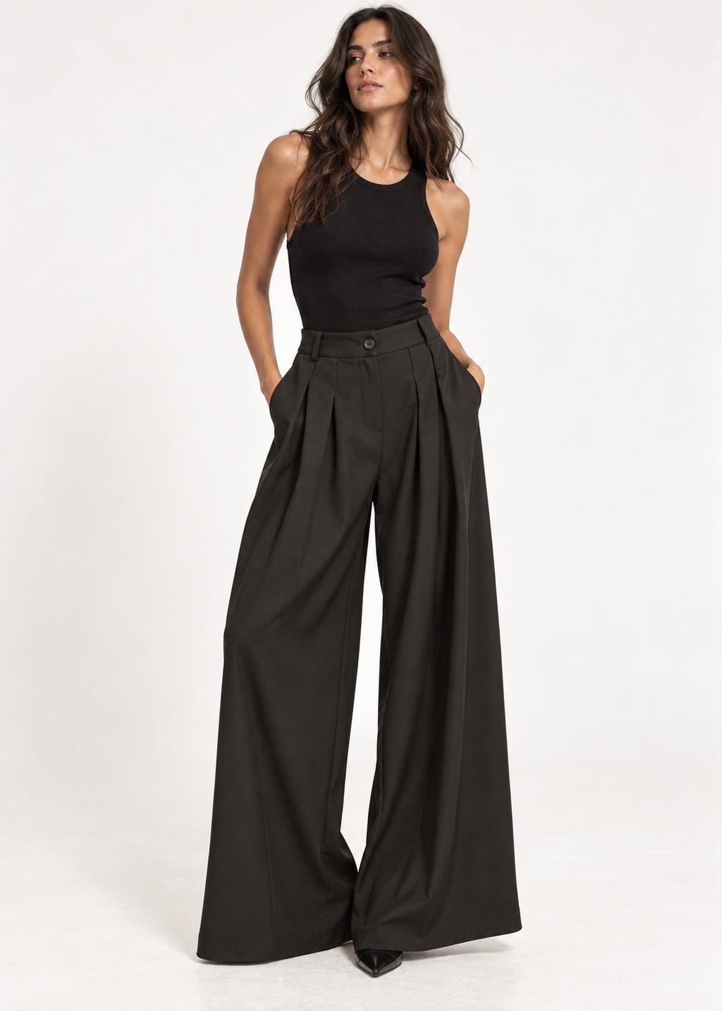Front view of black wide-leg trousers with a button waistband and deep pleats