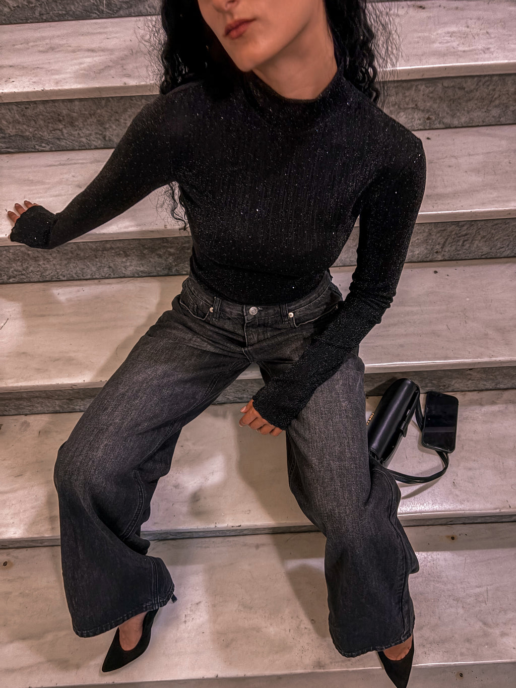 Black metallic-fleck high-neck bodysuit styled with a black fringe-hem skirt