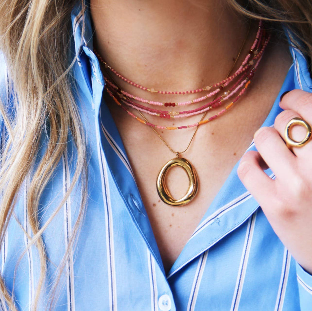 Delicate snake necklace with oval statement pendant