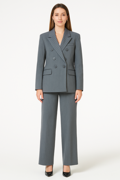 Woman wearing a gray pinstripe suit on a white background