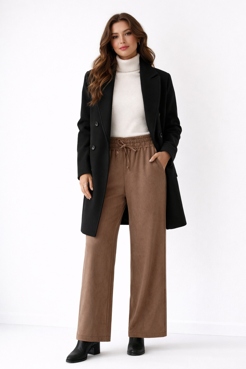 Brown pants with an elastic waistband on a white background