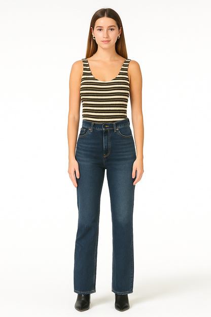Woman wearing a striped tank top and blue jeans on a white background